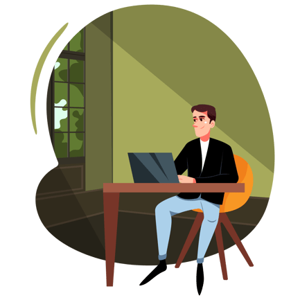 Man Works on His Laptop at His Desk at Home