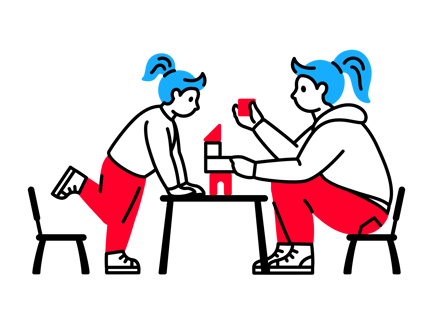 Child and a Woman Playing With Blocks