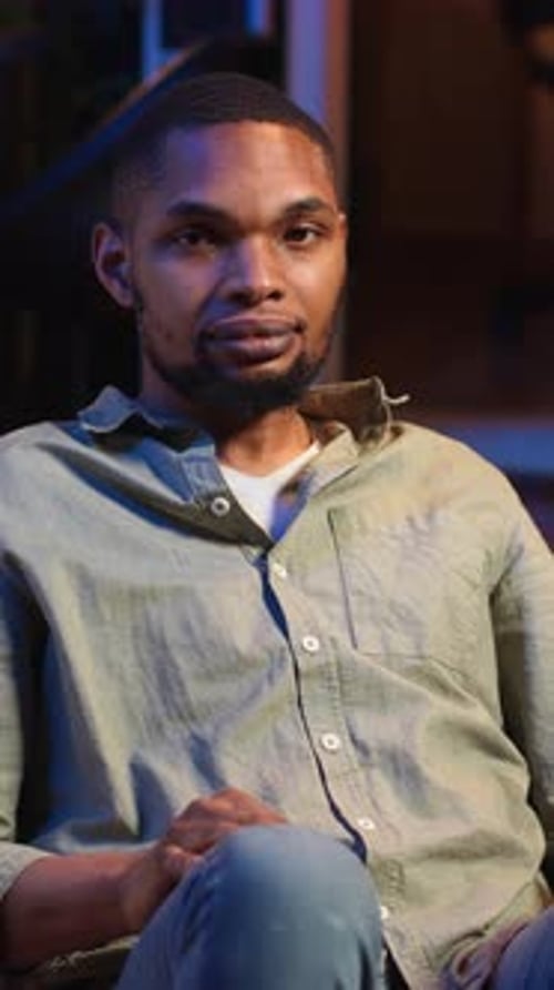 Young Adult Man Talking Indoors Portrait Orientation