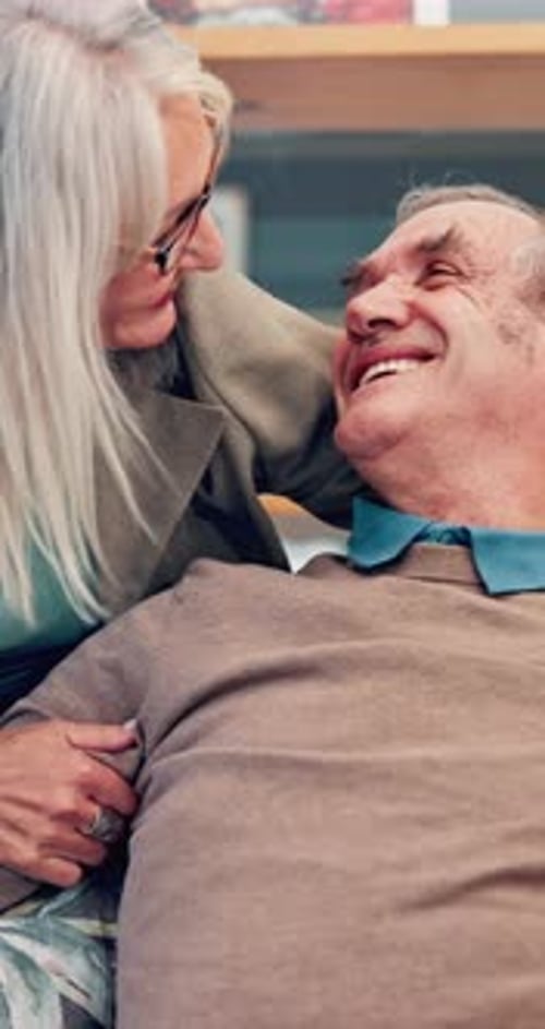 Senior Couple Hugging Lovingly Indoors