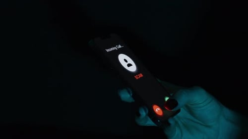 Hand Holding Smartphone Receiving a Scam Incoming Call