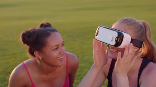 Virtual Reality Headset on Woman Outdoors. Close Up of Two Multi Ethnic