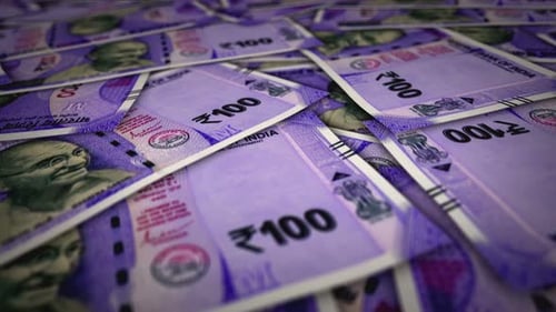 India Rupee 100 banknote flying over money surface