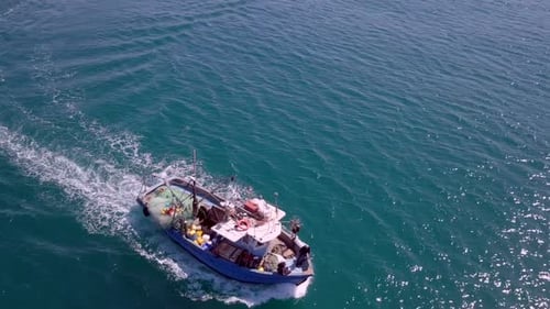 Samll fishing boat at sea - Aerial footage