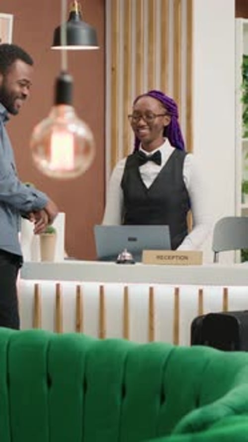 Vertical Video Tourist Registering at Luxury Hotel