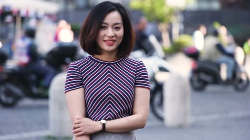 Confident Young Woman Posing in City