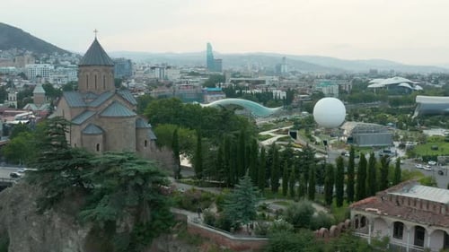 Aerial fly over view over Rike park passing Metekhi church in Tbilisi, Georgia. 4k footage