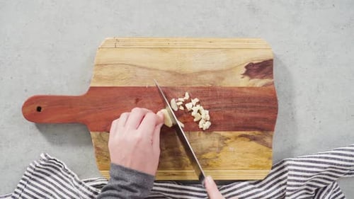 Time Lapse Cutting Organic Garlic on a Wood Cutting Board