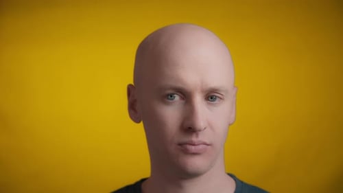 Man with blue eyes and bright skin looking worried