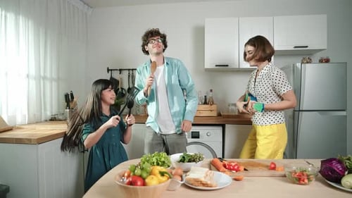 Family Plays Music with Kitchen Utensils in Kitchen
