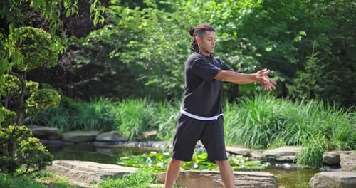 Healthy African American Man Exercising Ar Park Outdoor Practicing Yoga