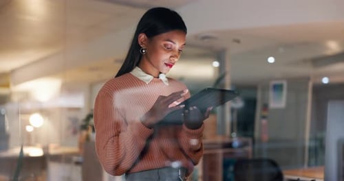 Night, office and business Indian woman on tablet for internet, website research and browse online