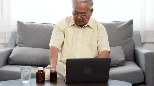 Senior Man Talking With Doctor on Video Call