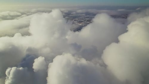 Cloudscape Moving Over City Partially Covered By Fog