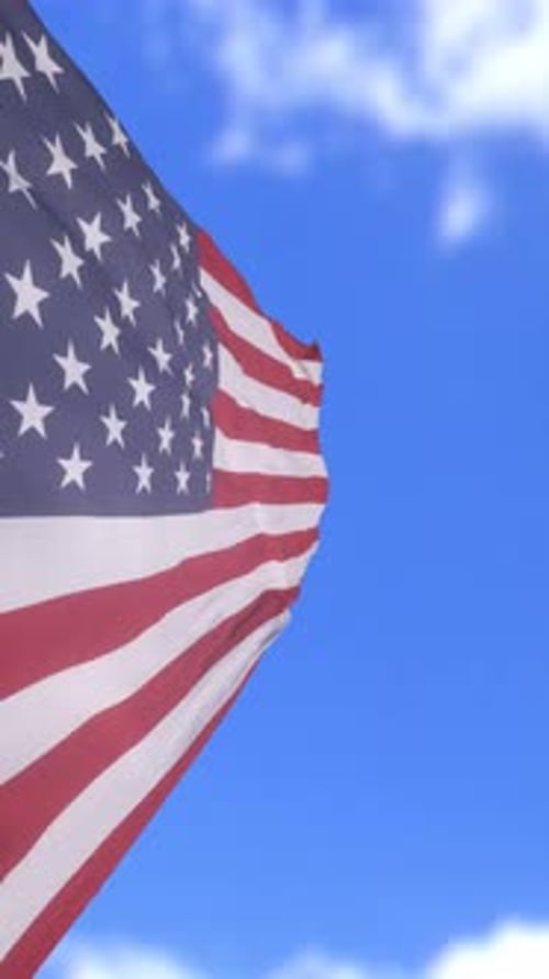 Waving American Flag in Blue Sky for Patriotic Events