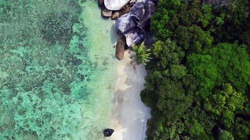 untoucht beach at granite rocks island, turquoise water. Breathtaking aerial view flight drone