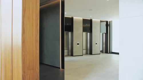 Modern Architecture with Marble Walls and Silver Elevators