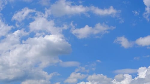 White Clouds Drifting across a Blue Sky