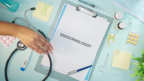 Endocrinologist's Desk with Medical Supplies and Documents