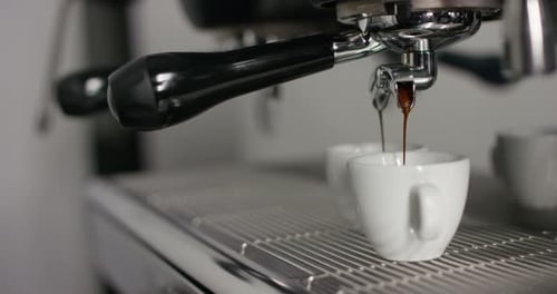 Coffee Pours From Espresso Machine Into Cup
