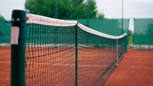 close-up of a net on an outdoor tennis court competition training sports equipment
