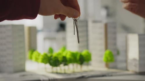Keys Passed Over Miniature Urban City Model