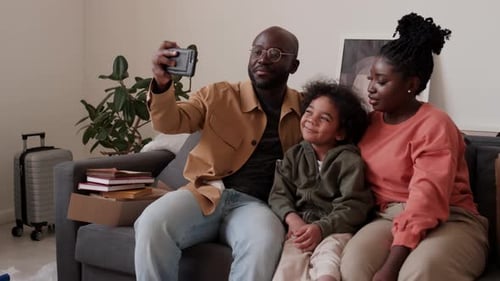 Happy Family Taking Selfie Together At Home