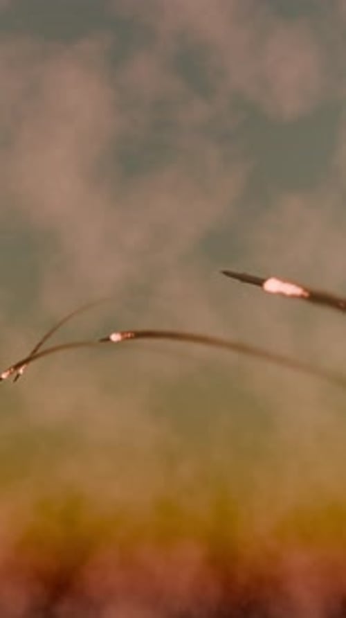 Military Rockets Launching into Sky with Fiery Smoke Trails