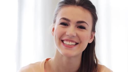 Smiling young woman portrait looking at the camera