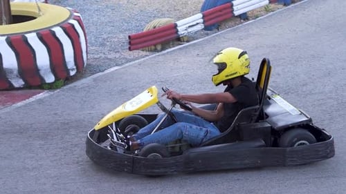 Karts crossing goal in a karting circuit. Go-kart racing children.