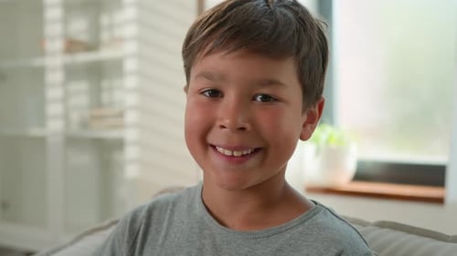 Happy Little Adorable Caucasian Boy Male Child Schoolboy Cheerful Looking at Camera Smiling Close Up