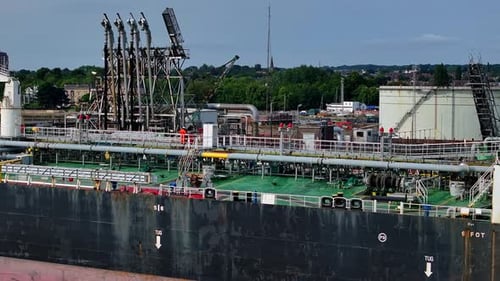 Worker on an Oil Tanker Ship Docked at Port