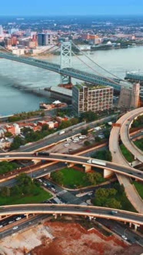 Transport going by the intertwining highways at waterfront of Delaware River in Philadelphia