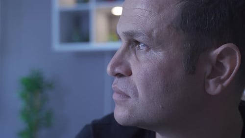 Man Gazing into Distance in Close Up View