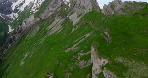 Spiky Alpstein Peak From Schafler Ridge Viewpoint At Sunrise In Appenzell, Switzerland. drone tilt-u