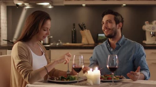 Couple Enjoying Romantic Candlelit Dinner at Home