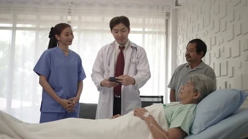 Doctor is take care senior patient at hospital room.