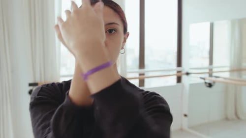Woman Dancing with Hands in Dance Studio