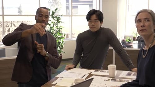 Multi Racial Business Colleagues Discussing in Modern Creative Office 30s