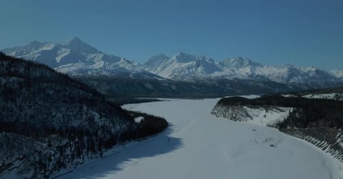 Aerial view of Frozen rivers and mountains in Alaska