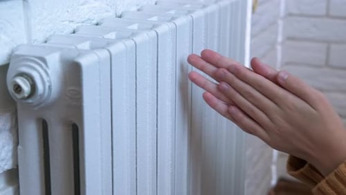 Keep Hands Warm on Radiator