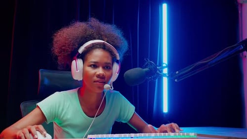 Woman Gamer Playing Video Games in her Room