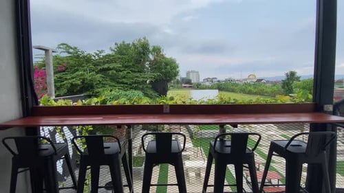 The footage shows the tables and chairs of customers of the concept coffee shop inside an aesthetic
