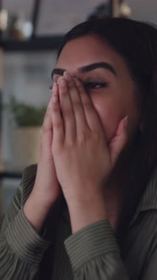 Dark Haired Woman Rubbing Temples Indoors