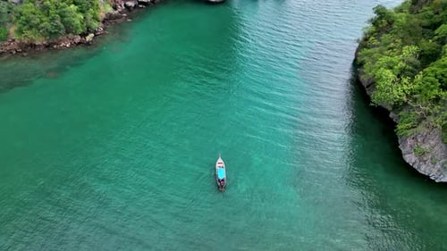 Longtail Boat On Turquoise Waters Of Tonsai Beach Near Krabi In Ao Nang, Thailand. aerial drone
