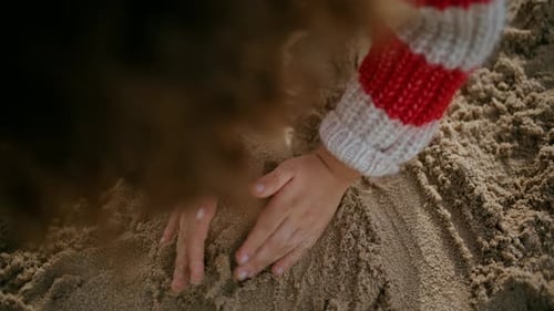 Kid Hands Building Sand Castle on Seashore Weekend. Creative Boy Enjoying Game
