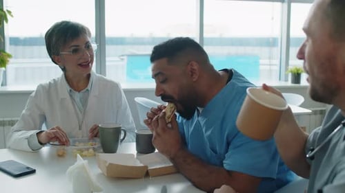 Medical Staff Eating Lunch Together in Hospital