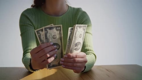 Hands Counting American Two Dollar Bills