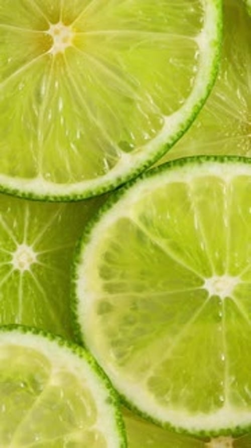 Lime Slices Closeup Fruits Background Top View Rotating
