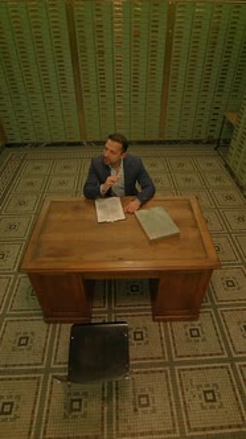 An Isolated Office with a Charming Wooden Desk and Lush Green Walls Perfect for Focus